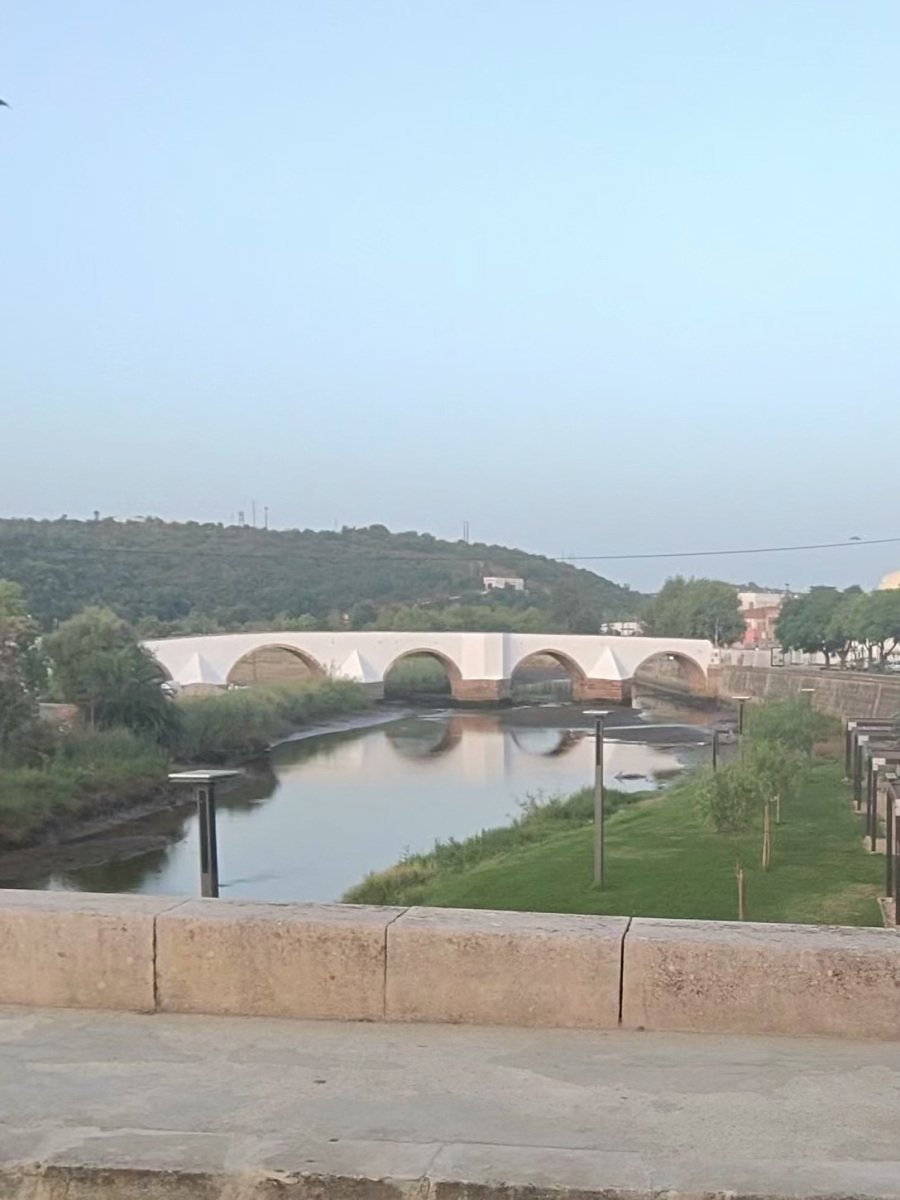 The old arched bridge over the River Arade in Silves in early morning light