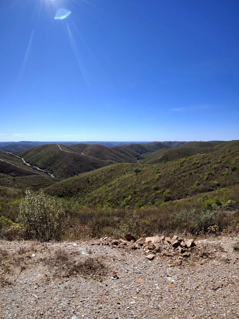 Dry, scrubby hills of the serra north of Silves rolling away to the horizon under a clear blue sky